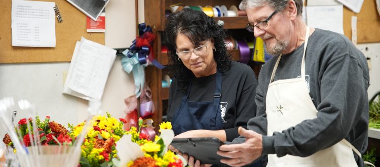 Florists looking at a tablet
